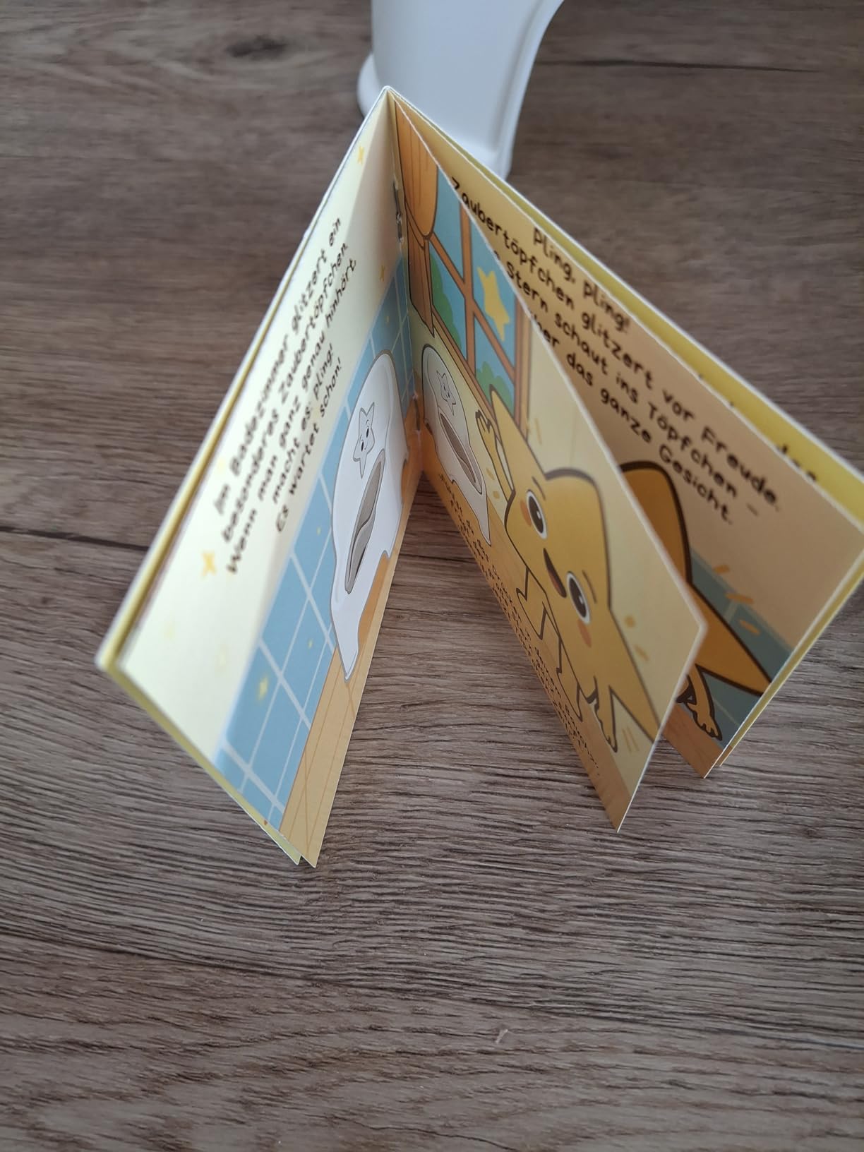 Little Star Topfstuhl mit Bilderbuch und Spritzschutz